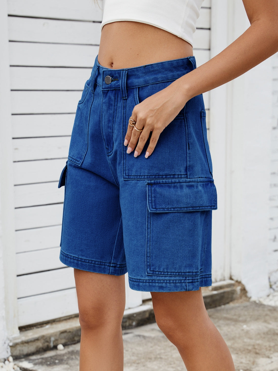 High-waist denim shorts with cargo pockets.