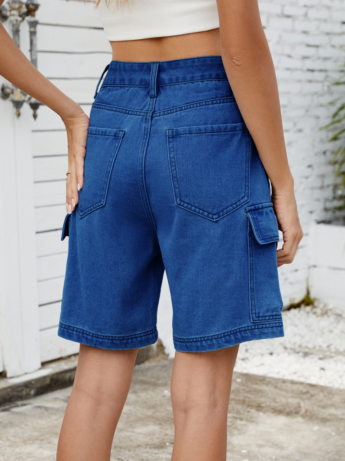 High-waist denim shorts with cargo pockets.