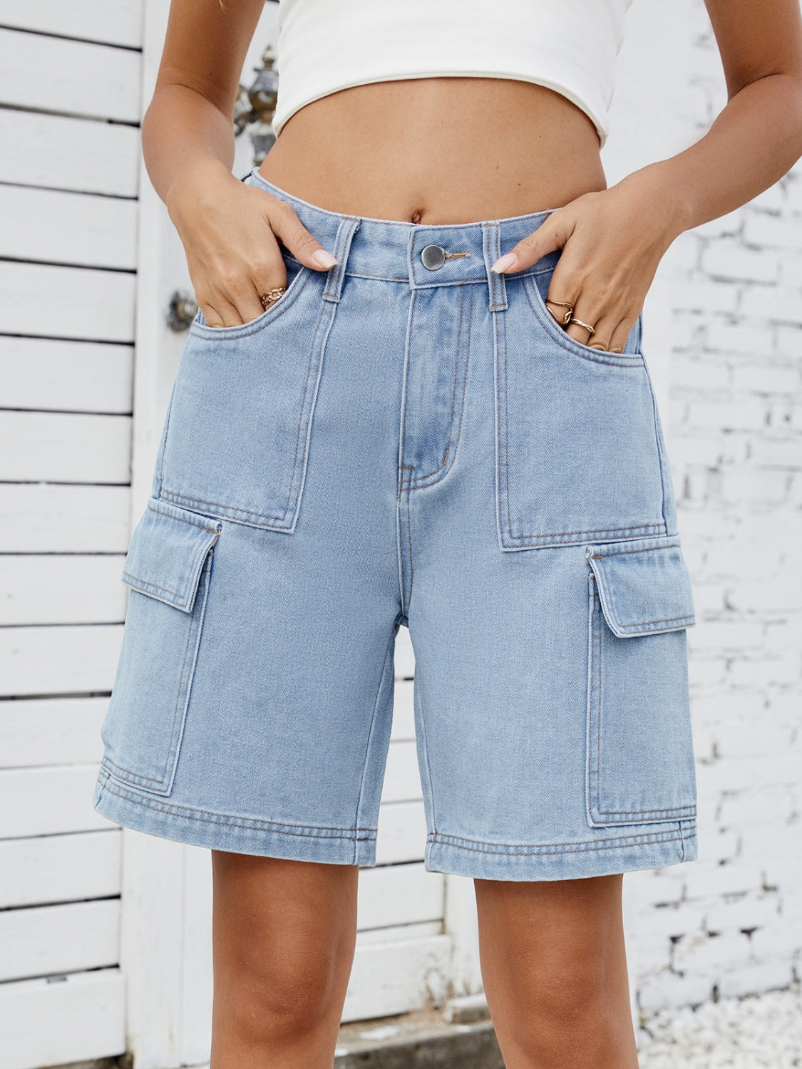 High-waist denim shorts with cargo pockets.