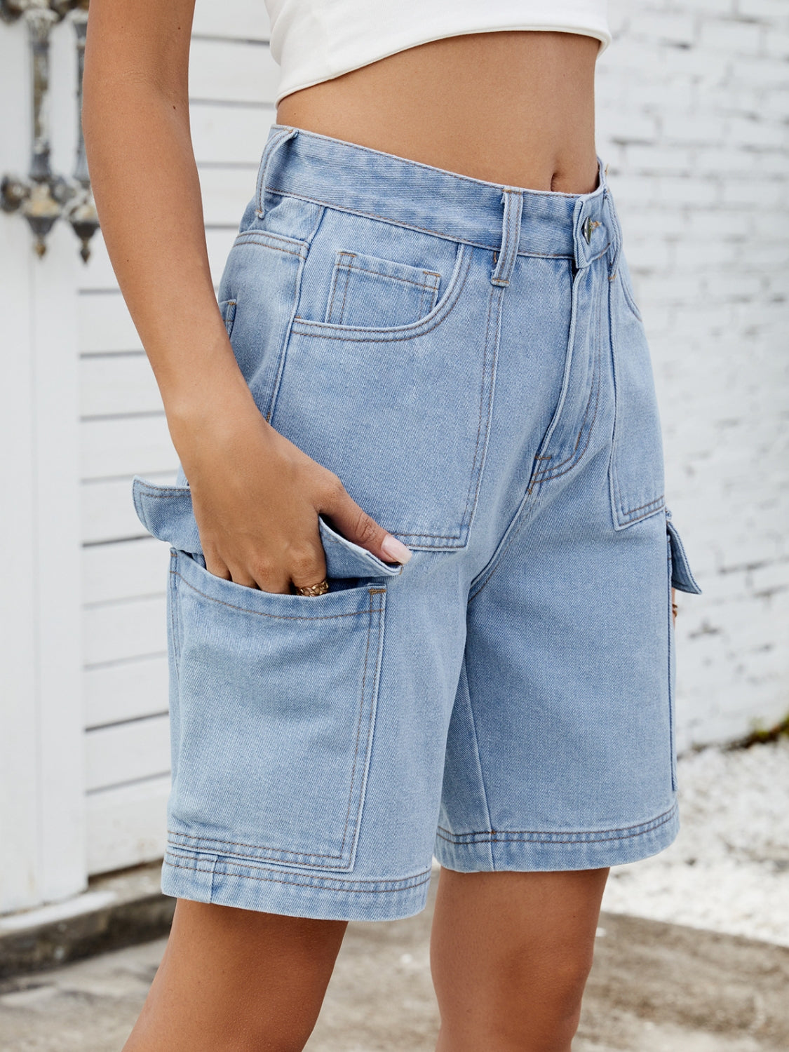 High-waist denim shorts with cargo pockets.