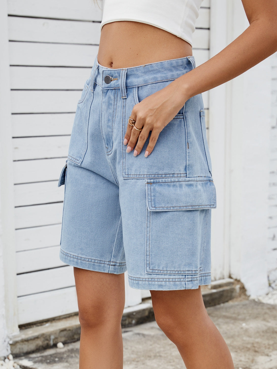 High-waist denim shorts with cargo pockets.
