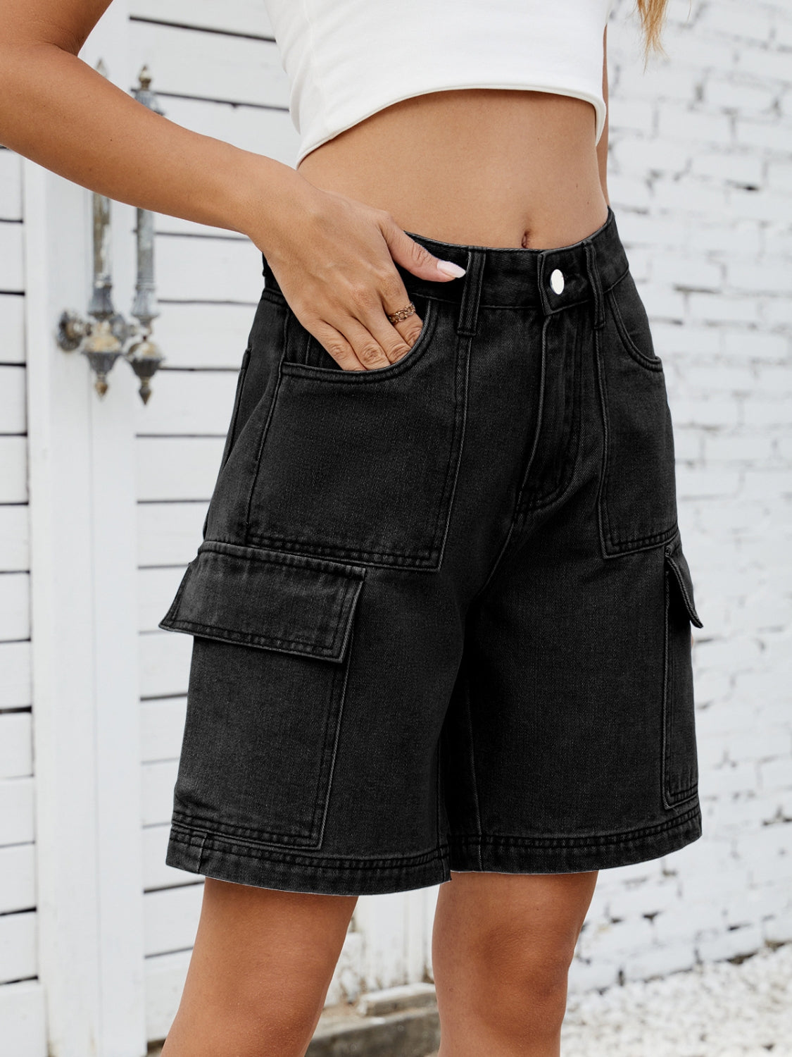High-waist denim shorts with cargo pockets.