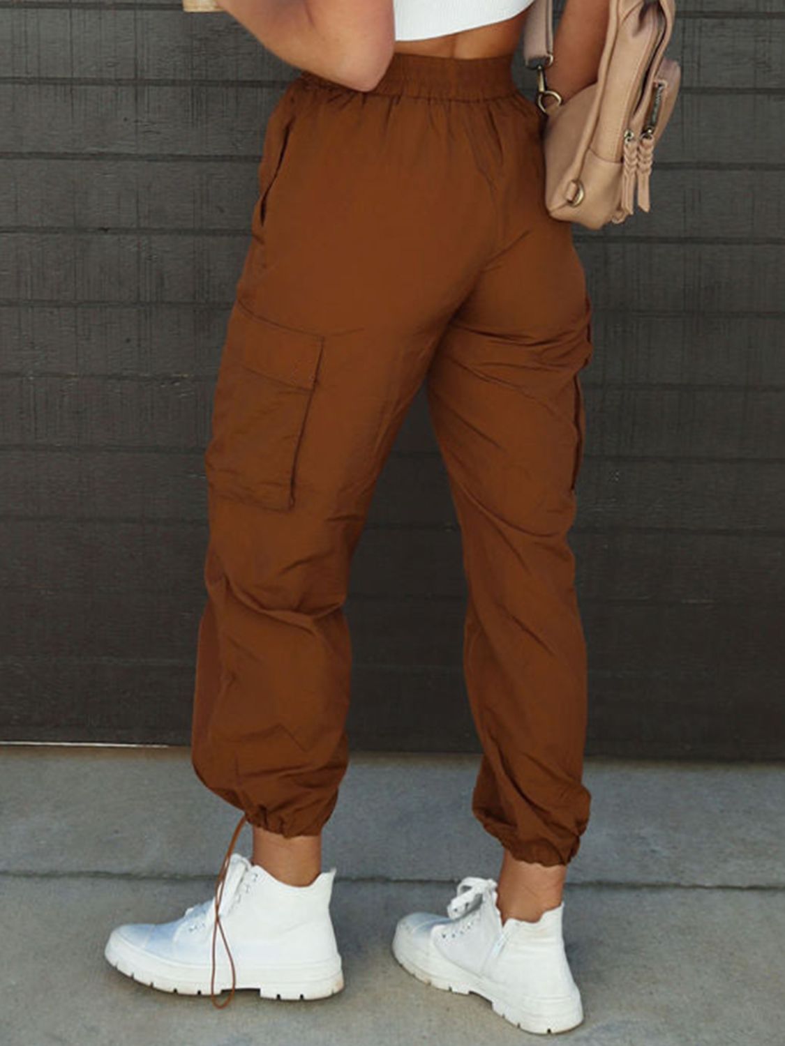 High waist drawstring pants with pockets, opaque.