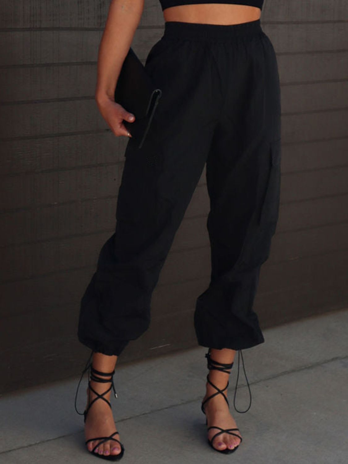 High waist drawstring pants with pockets, opaque.