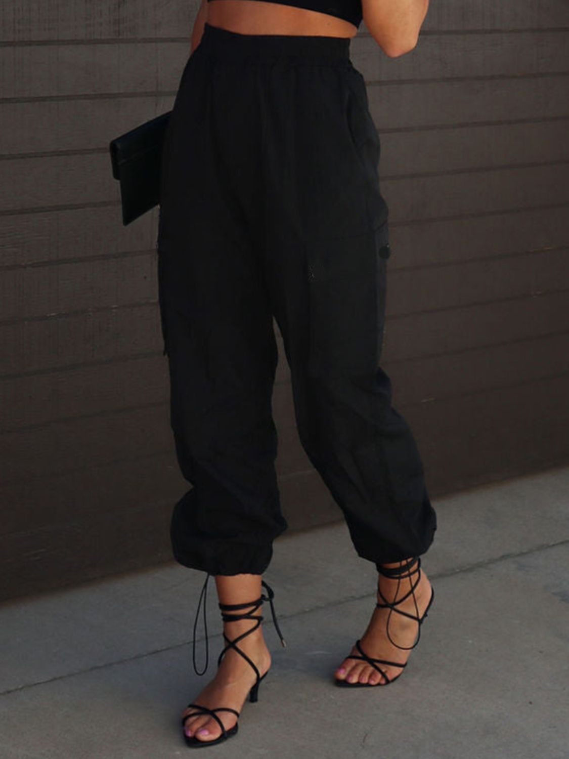 High waist drawstring pants with pockets, opaque.