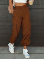 High waist drawstring pants with pockets, opaque.