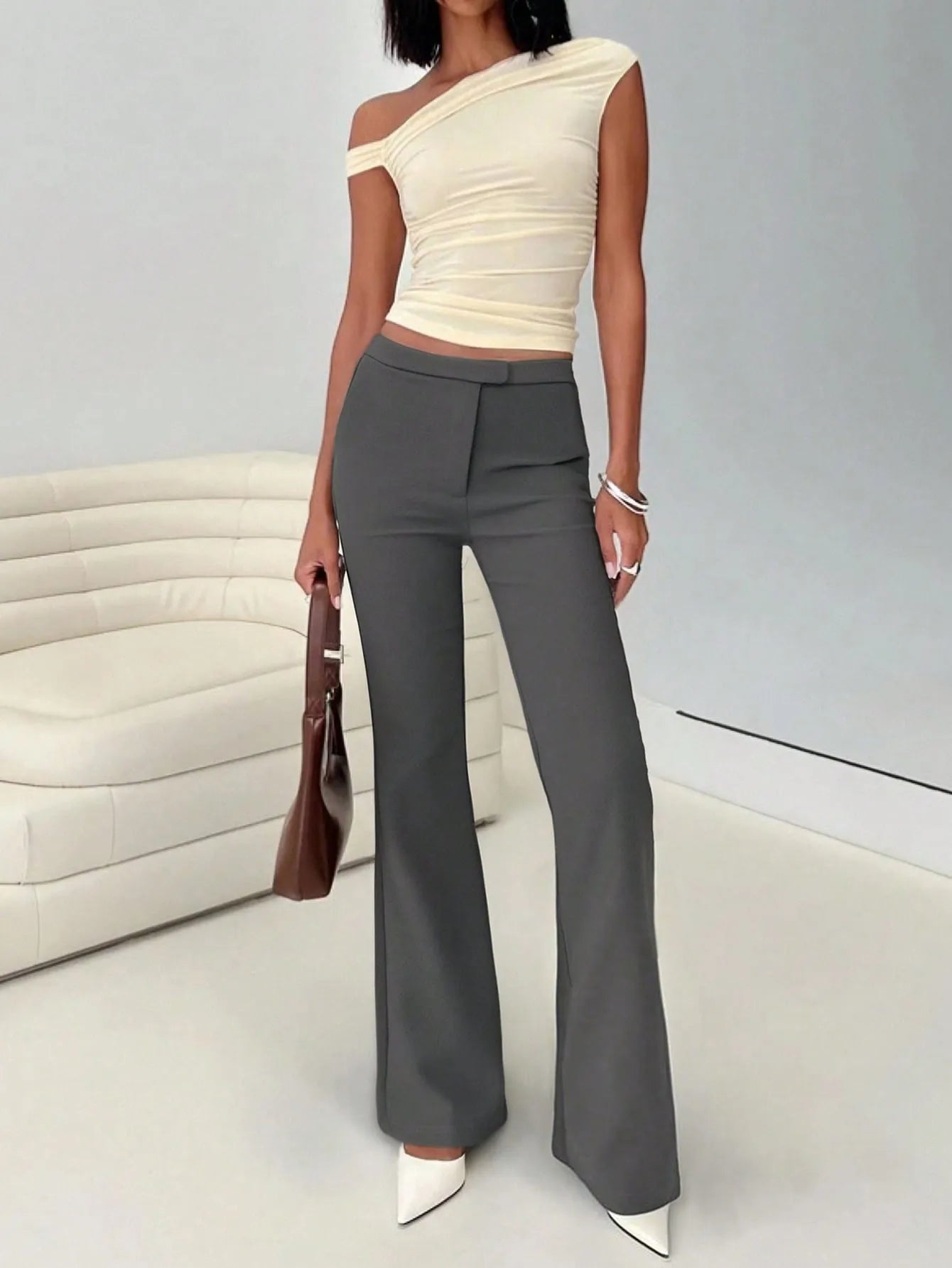 High waist flare leg trousers with buttons and pockets.