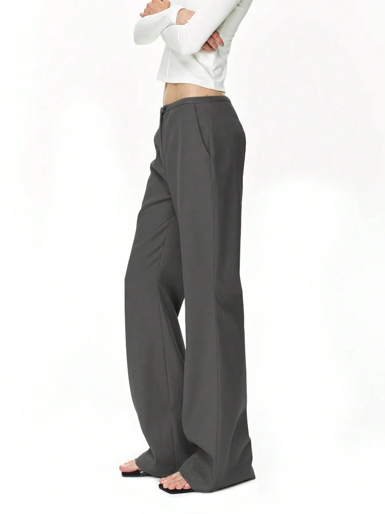 High waist flare leg trousers with buttons and pockets.