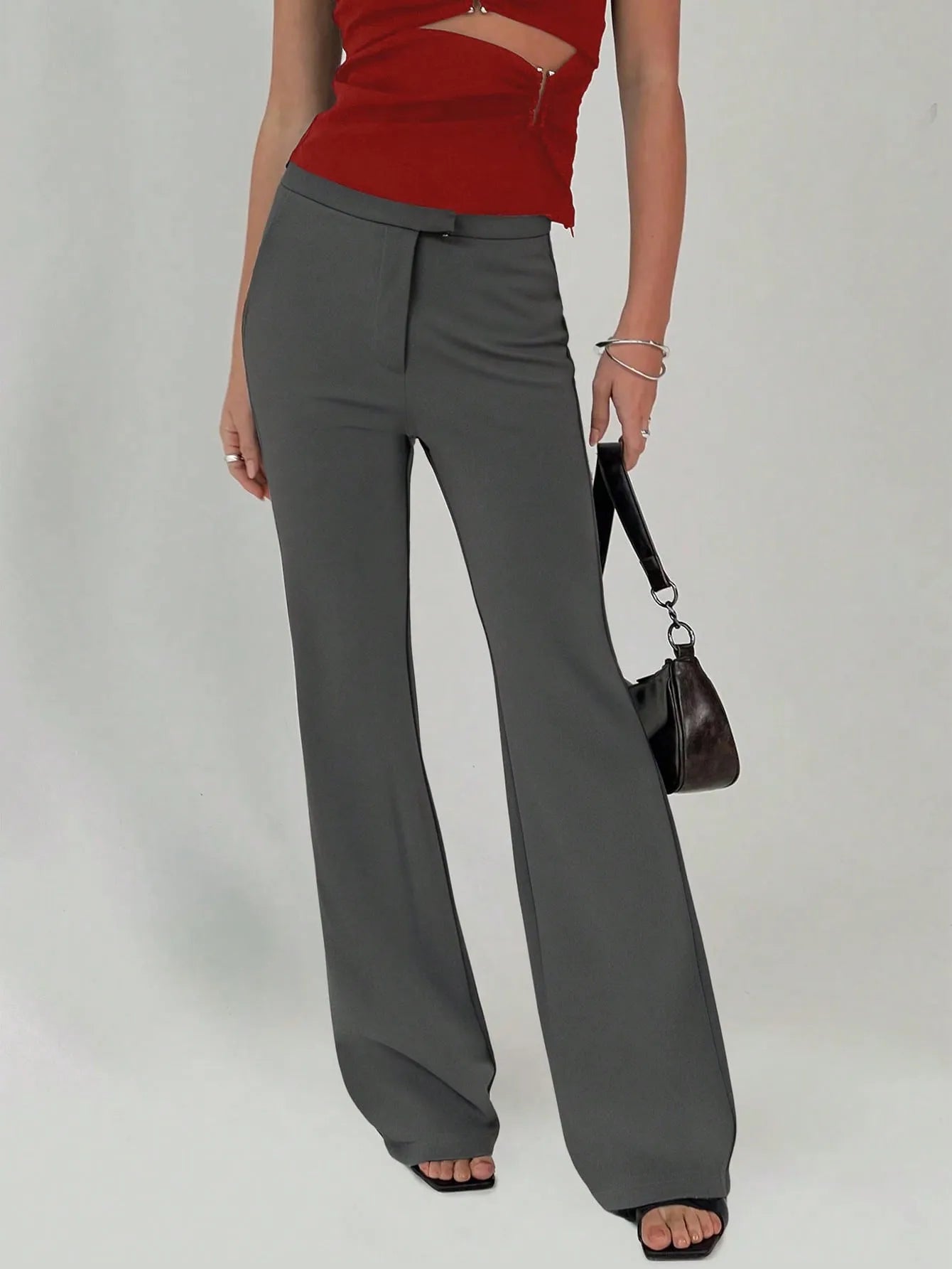 High waist flare leg trousers with buttons and pockets.