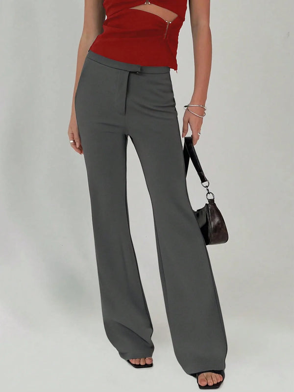 High waist flare leg trousers with buttons and pockets.