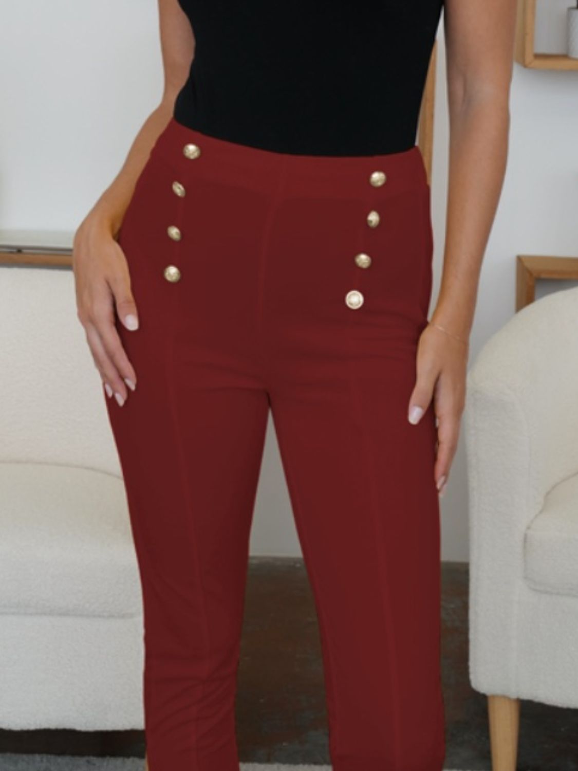 High waist skinny pants with decorative buttons, opaque.