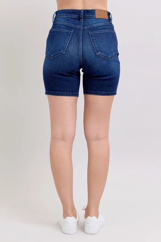High-waist vintage wash side slit denim shorts with raw hem and pockets.