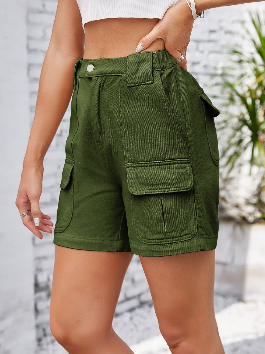 High-waist western embroidery detail cut-off denim shorts with raw hem and pockets.