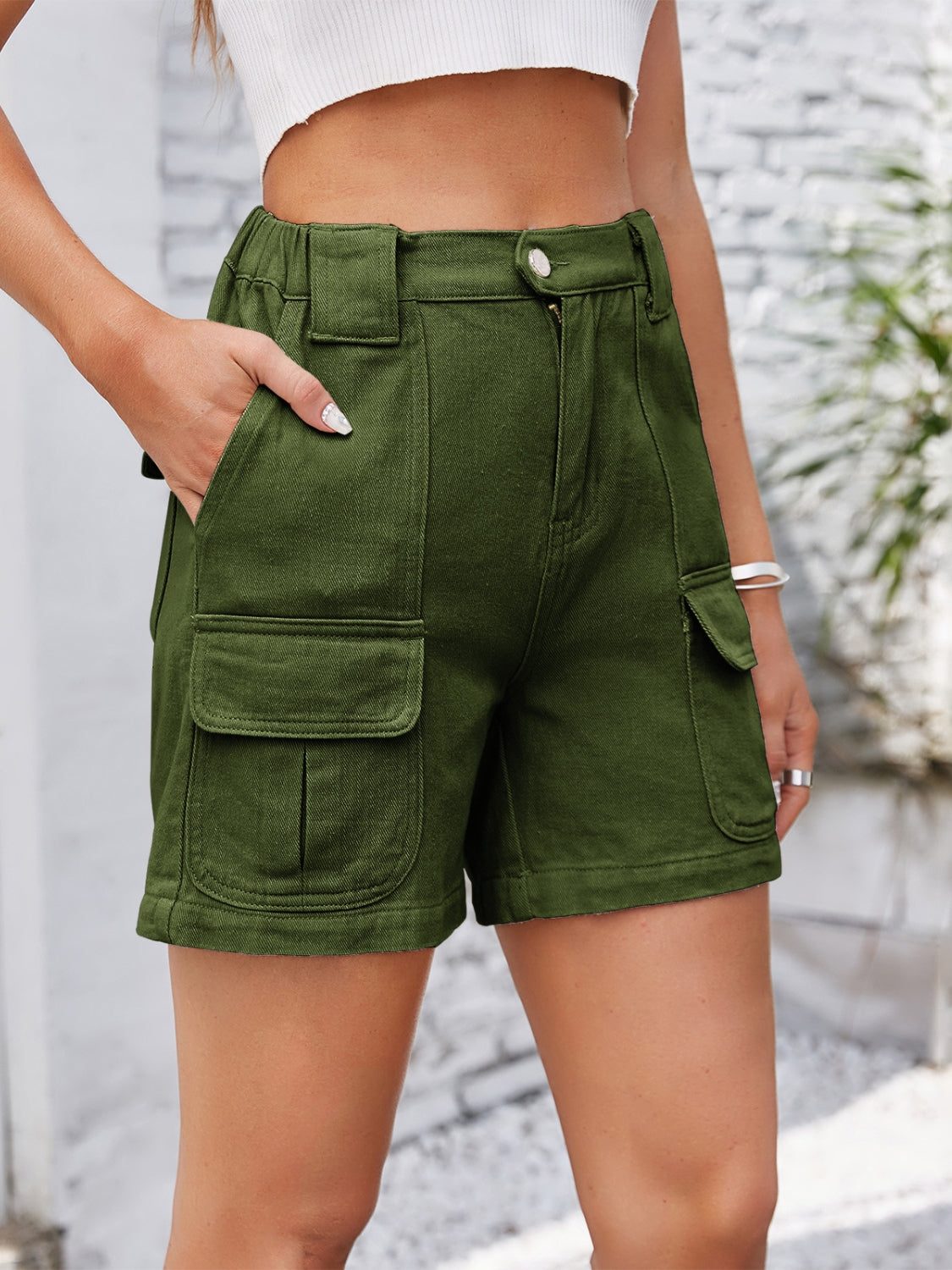 High-waist western embroidery detail cut-off denim shorts with raw hem and pockets.