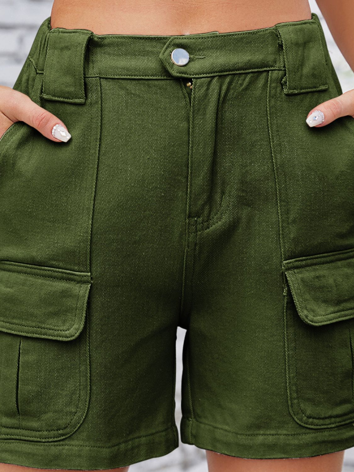 High-waist western embroidery detail cut-off denim shorts with raw hem and pockets.