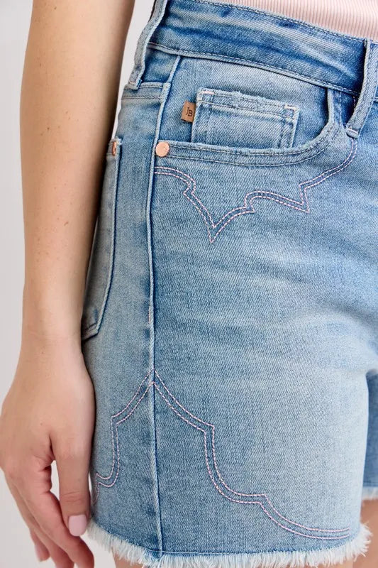 High-waisted denim shorts with roll-up option.