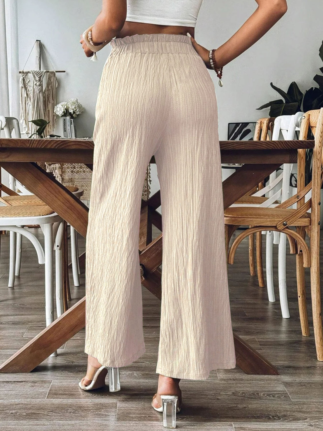 High waist wide leg pants with smocking and pockets, opaque.