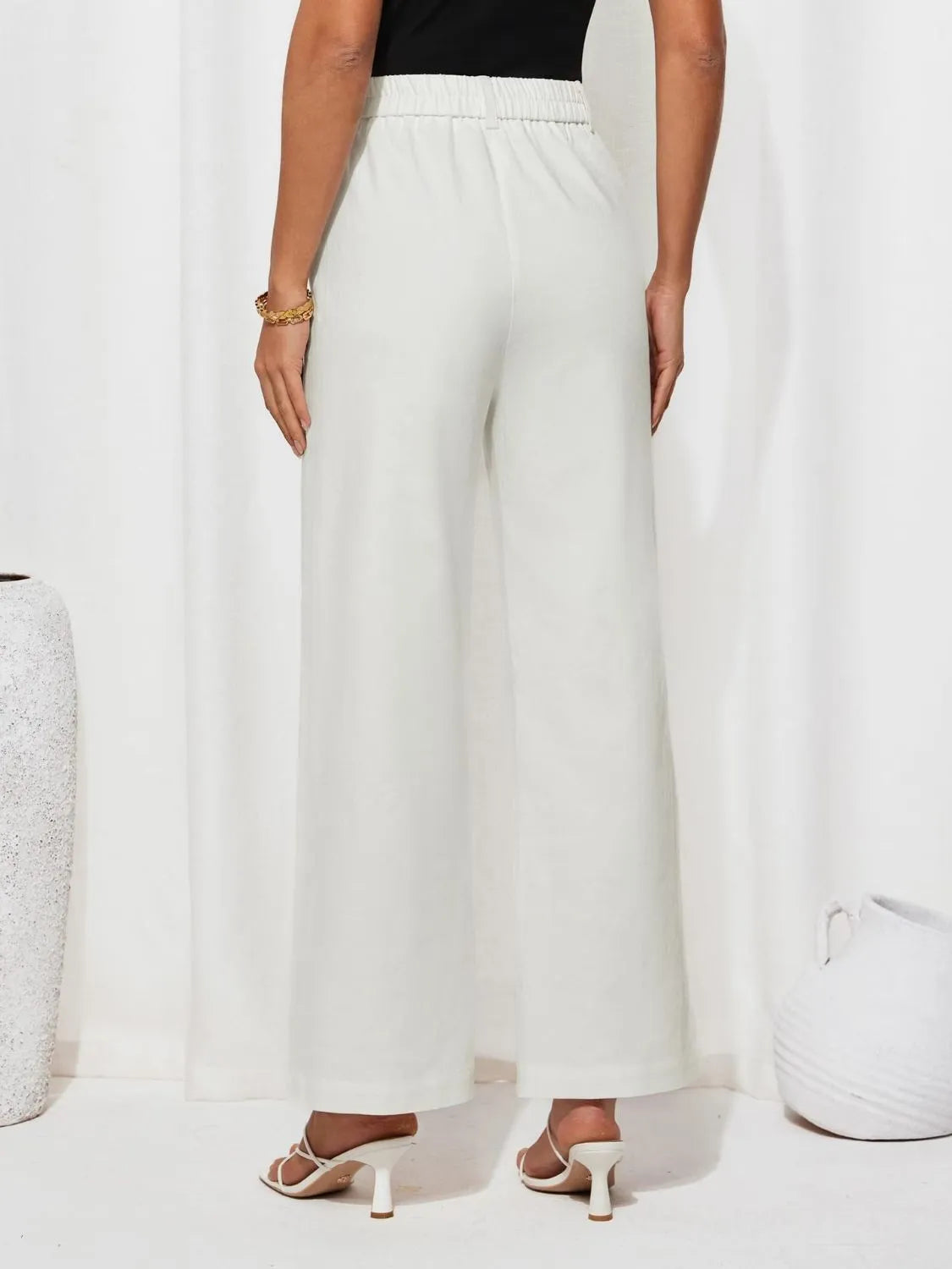 High waist wide leg pants with buttons and pockets.