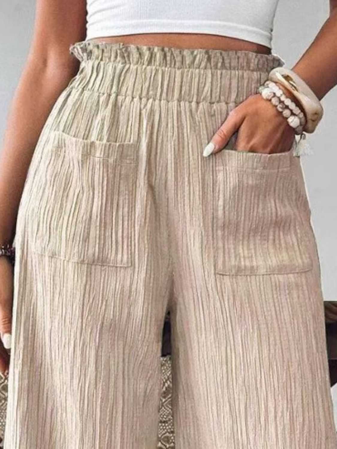 High waist wide leg pants with smocking and pockets, opaque.