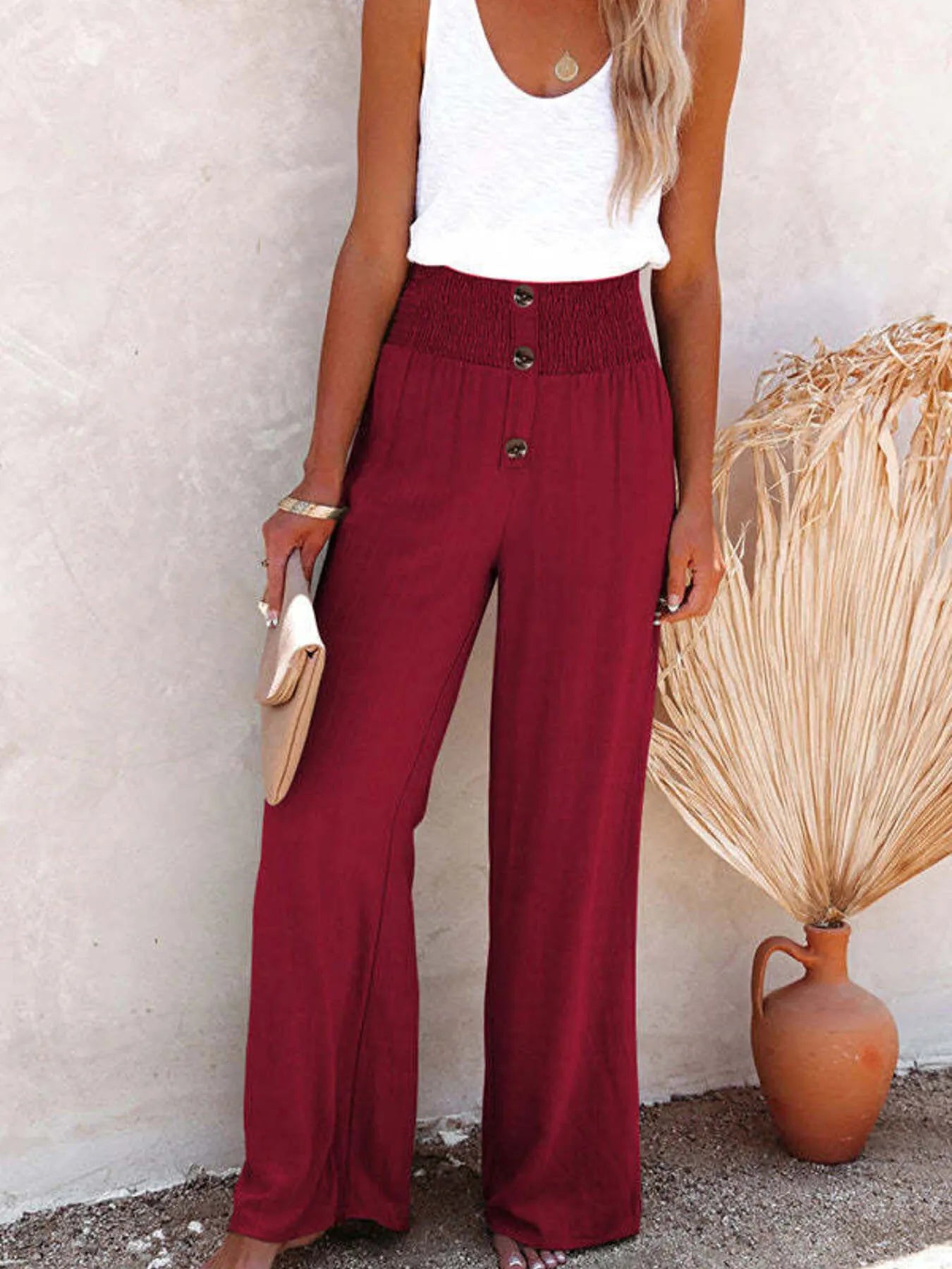 High-waisted textured wide leg pants plus size with decorative buttons.