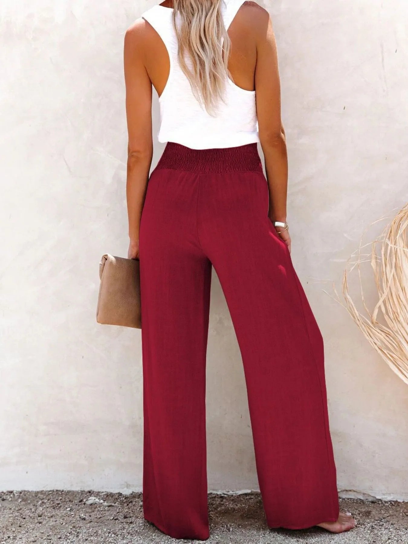 High-waisted textured wide leg pants plus size with decorative buttons.