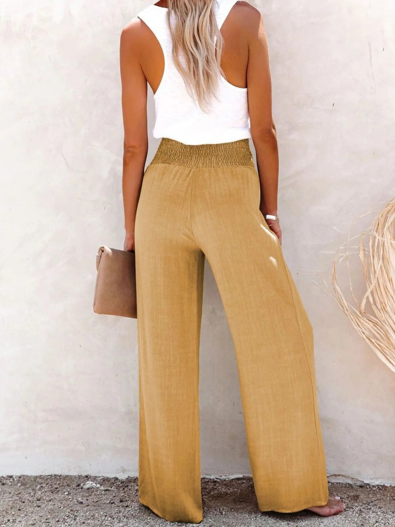High-waisted textured wide leg pants plus size with decorative buttons.
