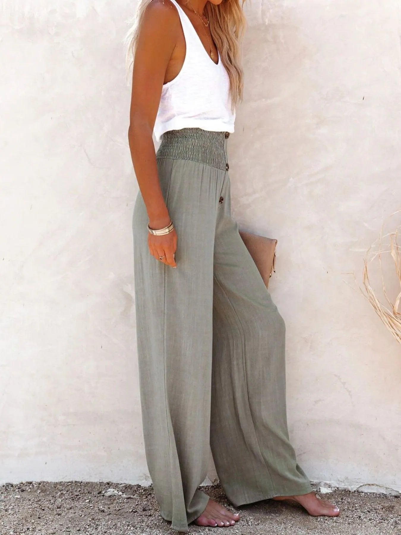 High-waisted textured wide leg pants plus size with decorative buttons.