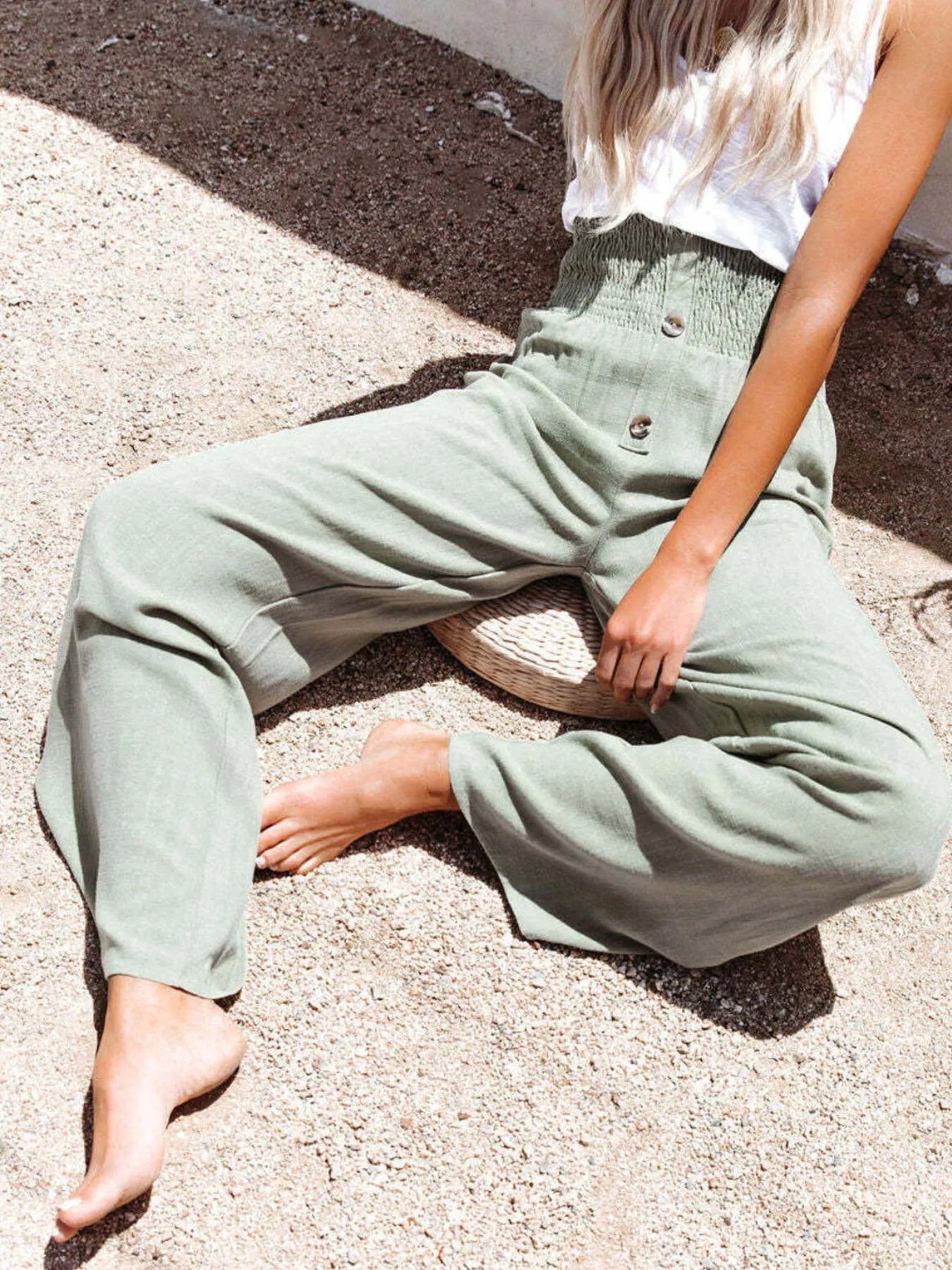 High-waisted textured wide leg pants plus size with decorative buttons.