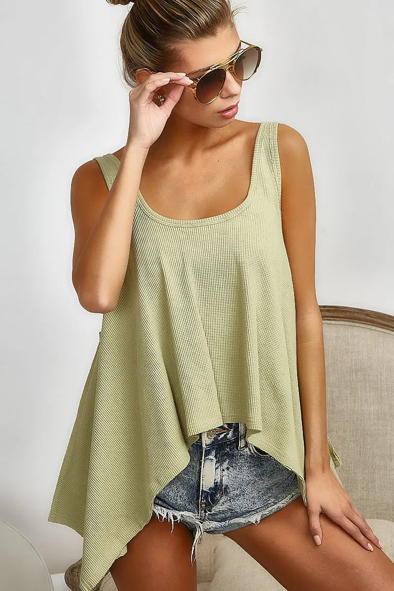 High and low flare knit tank top with oversized asymmetrical design, slightly stretchy.
