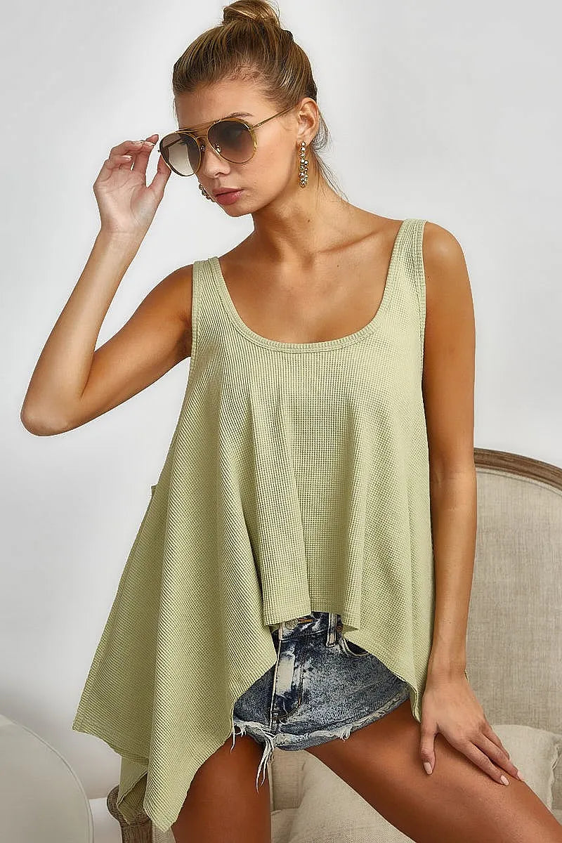 High and low flare knit tank top with oversized asymmetrical design, slightly stretchy.