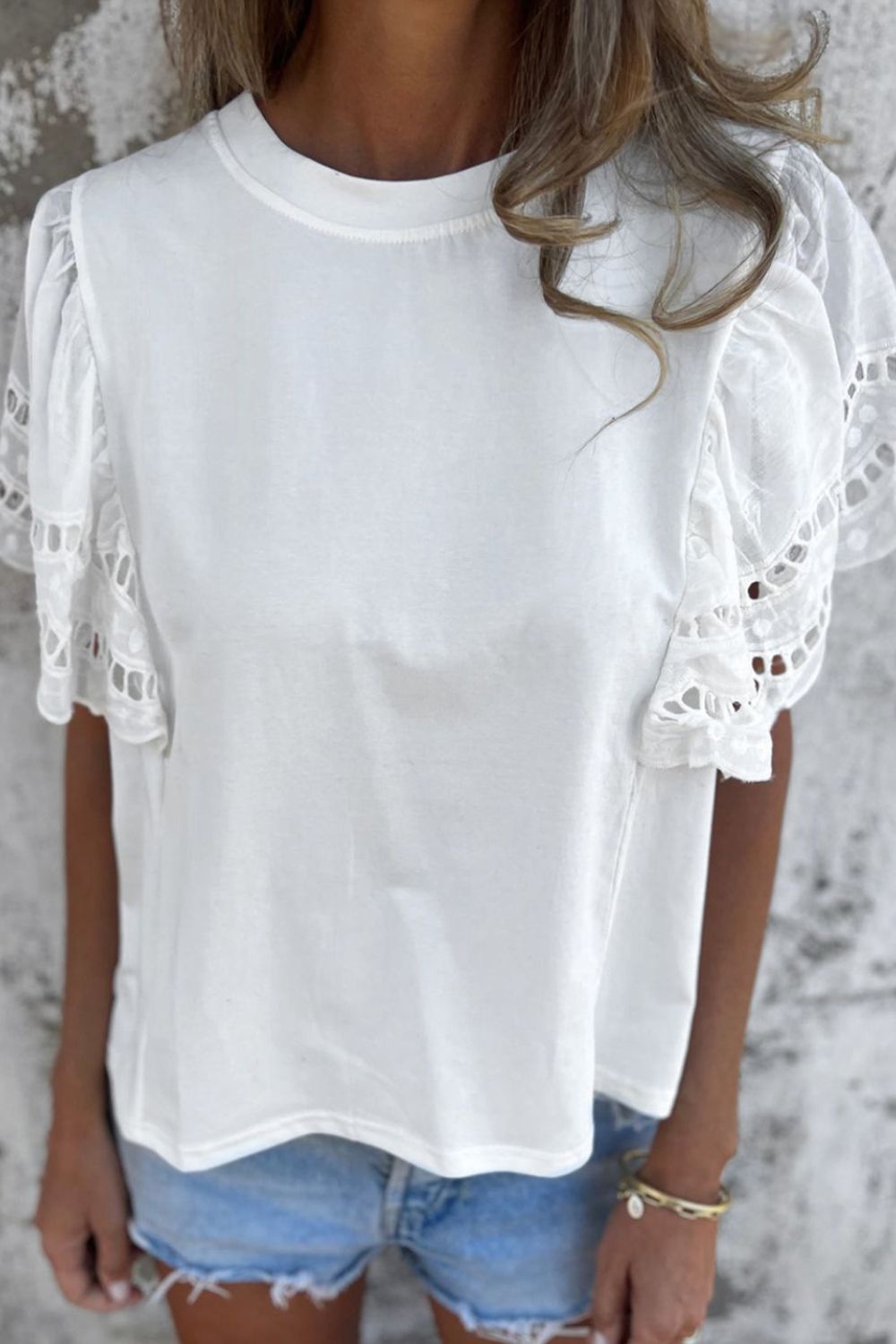 Hollow out embroidered short sleeve round neck top.