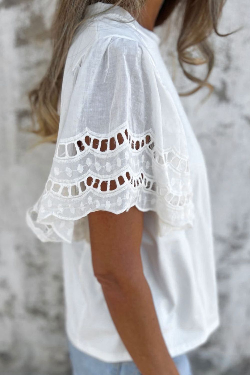 Hollow out embroidered short sleeve round neck top.