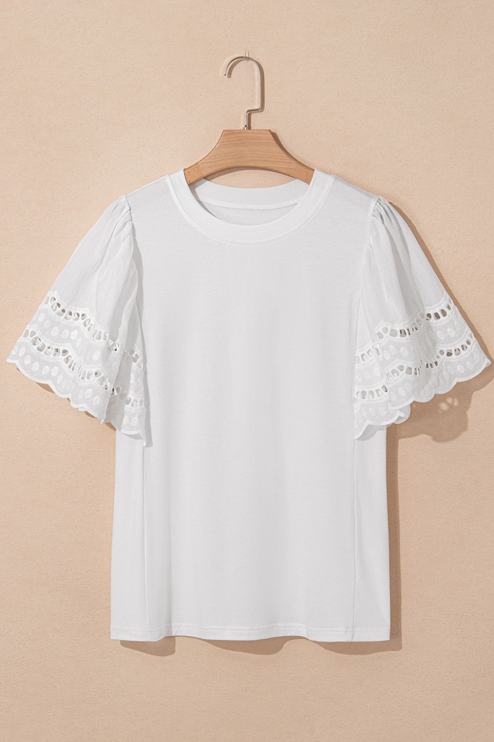 Hollow out embroidered short sleeve round neck top.