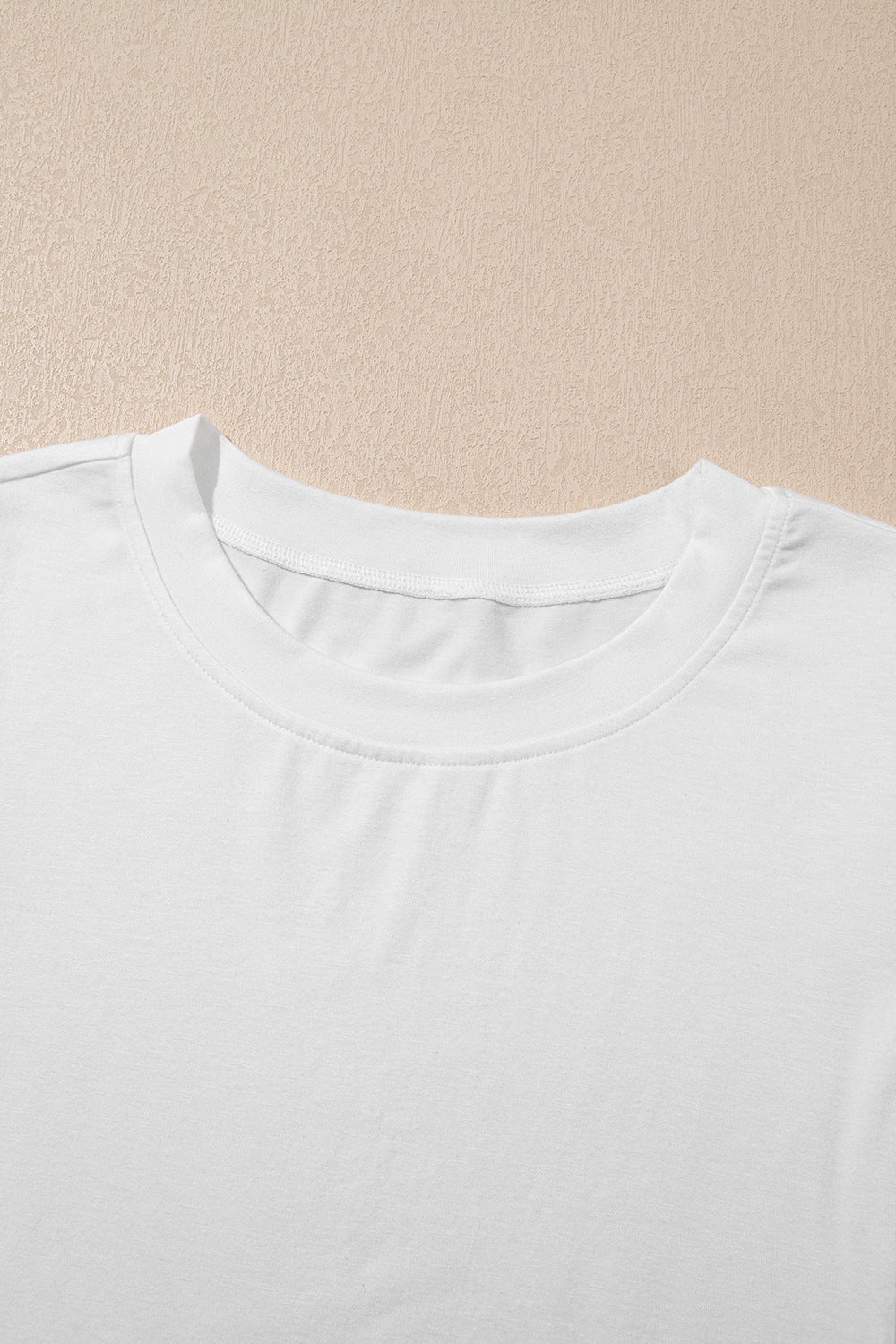 Hollow out embroidered short sleeve round neck top.