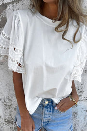 Hollow out embroidered short sleeve round neck top.