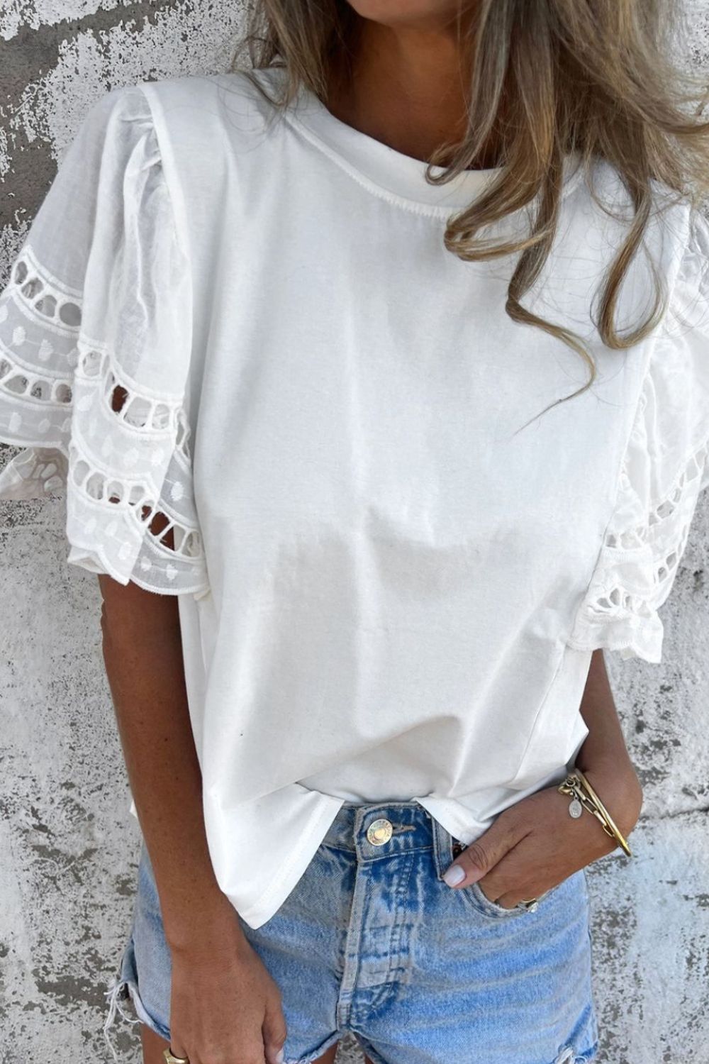Hollow out embroidered short sleeve round neck top.