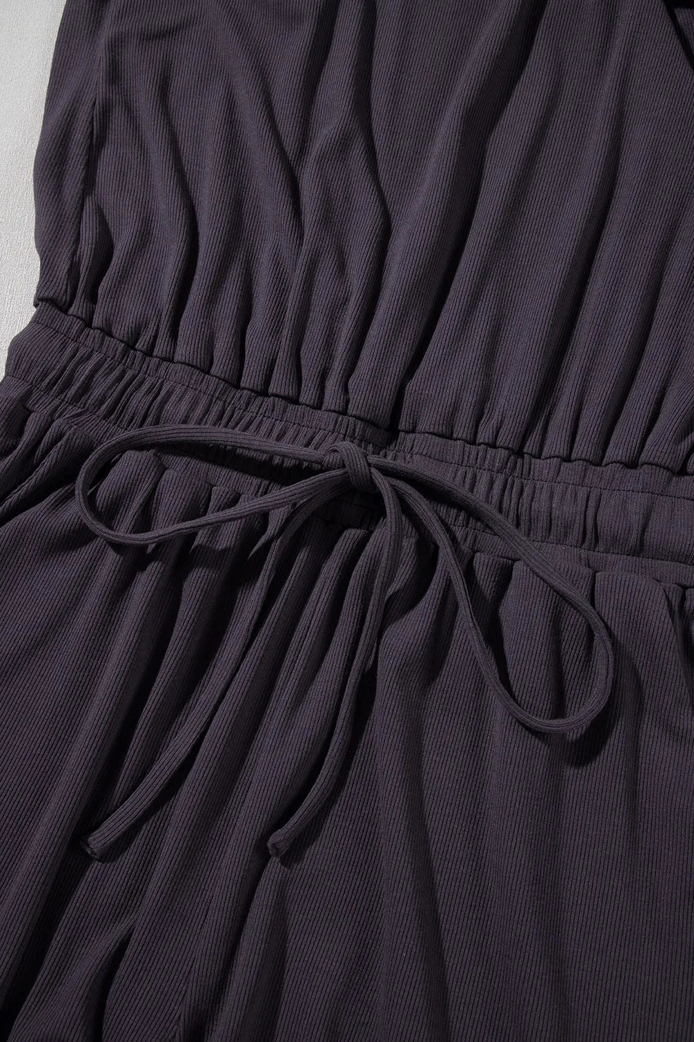 Knit Open Back Cap Sleeve Drawstring Romper.
