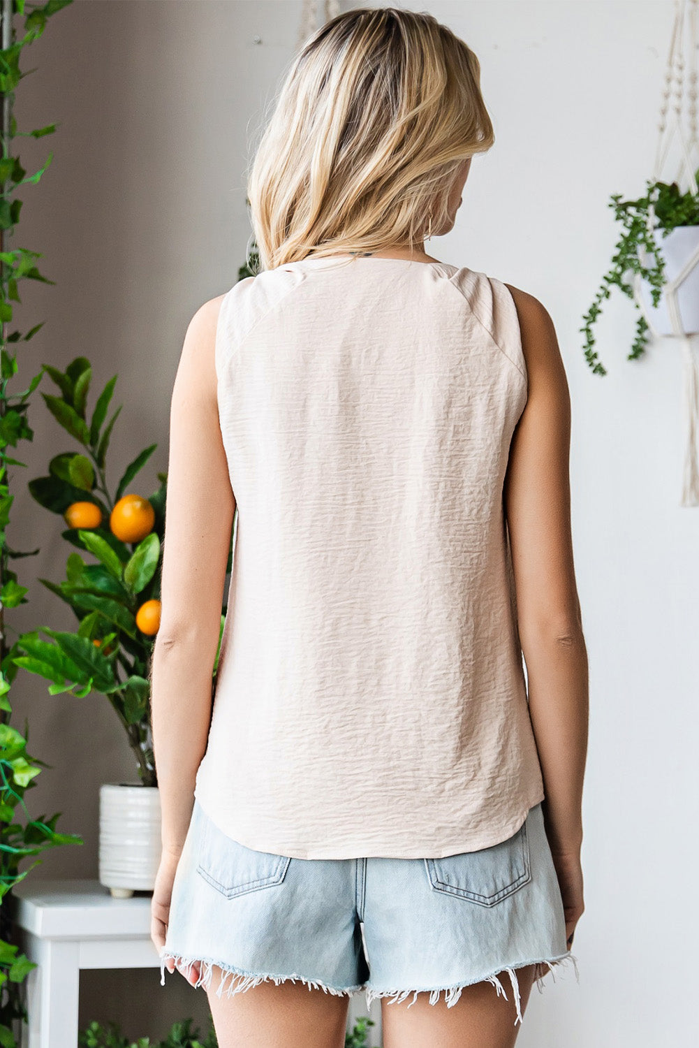 V-neck tank top with knot detail.