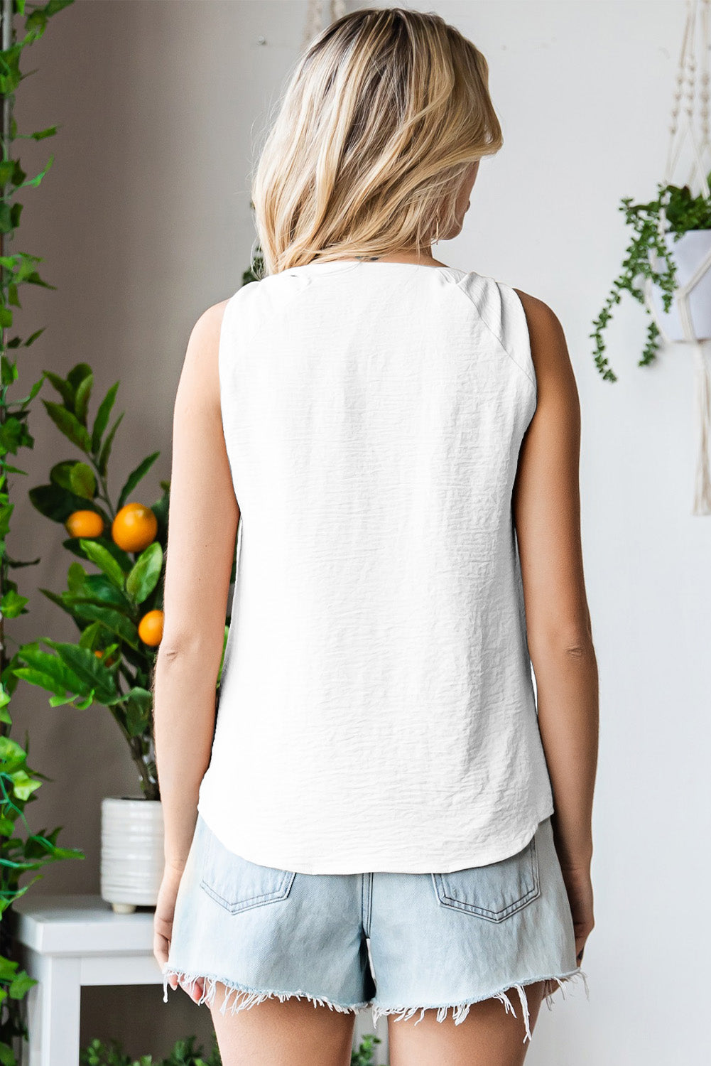 V-neck tank top with knot detail.
