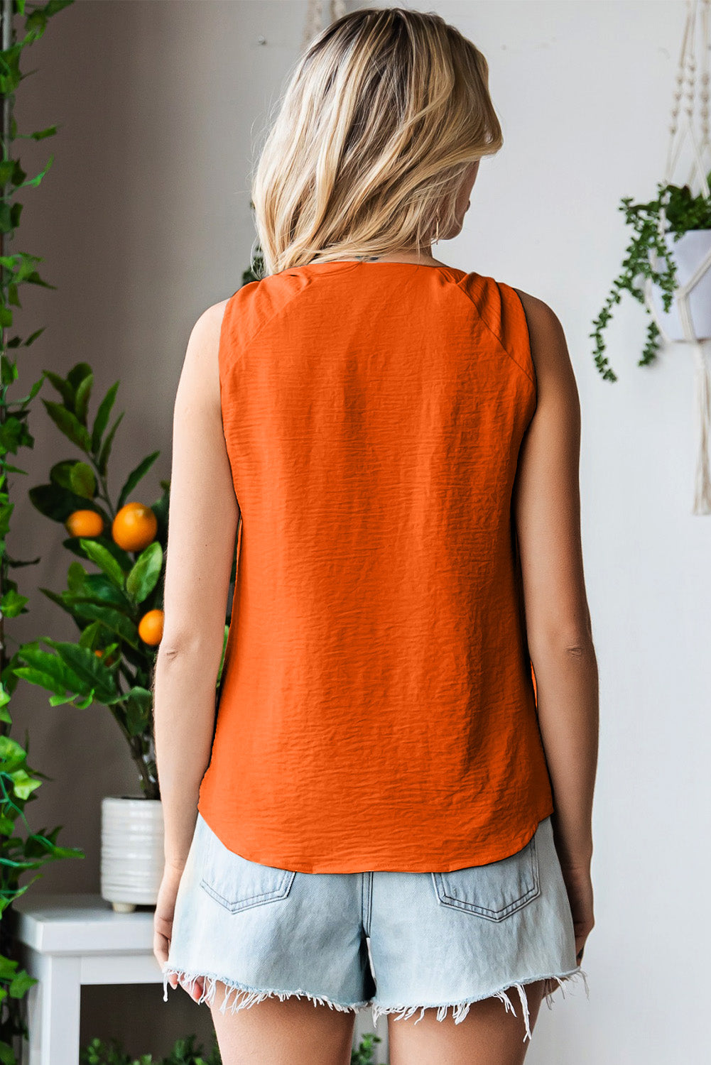 V-neck tank top with knot detail.