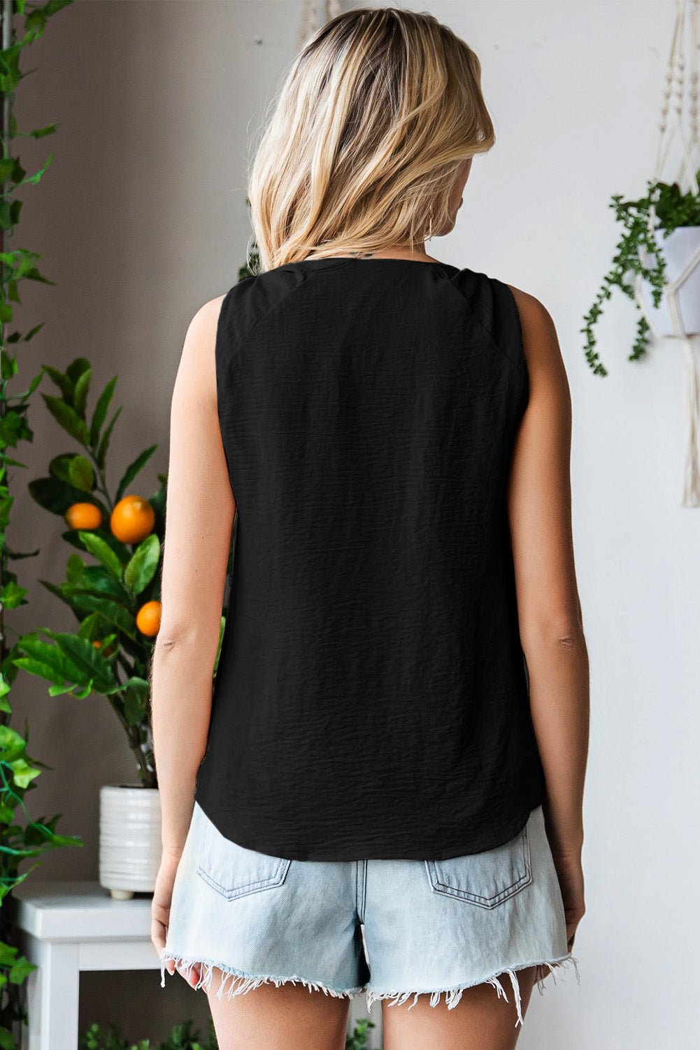 V-neck tank top with knot detail.