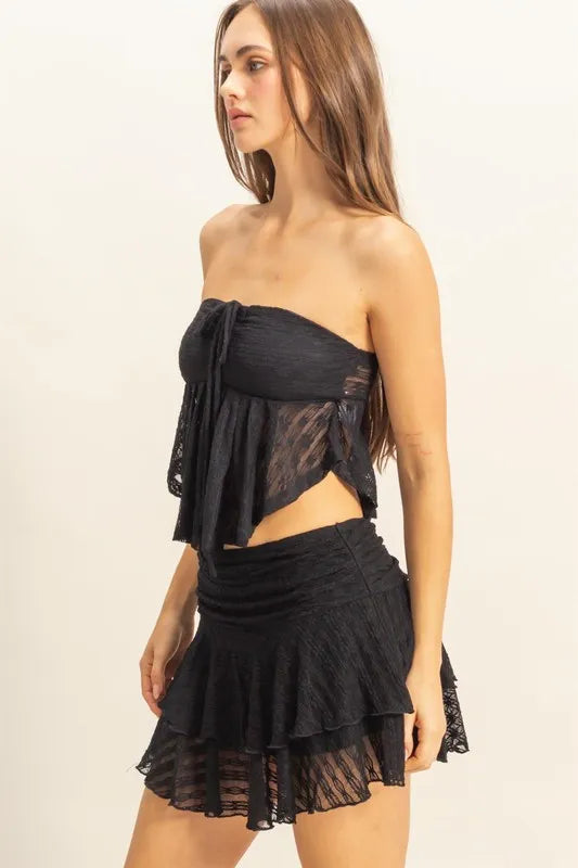 Lace bustier flowy tube top with tie detail, sheer and slightly stretchy.