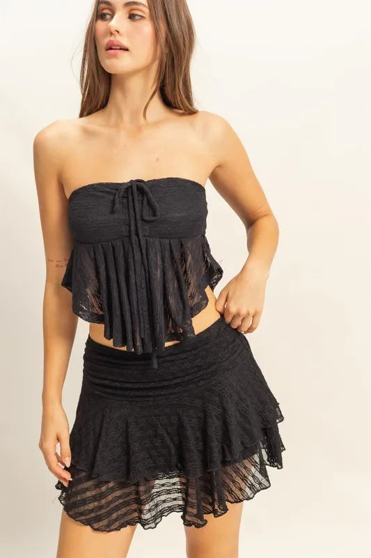 Lace bustier flowy tube top with tie detail, sheer and slightly stretchy.