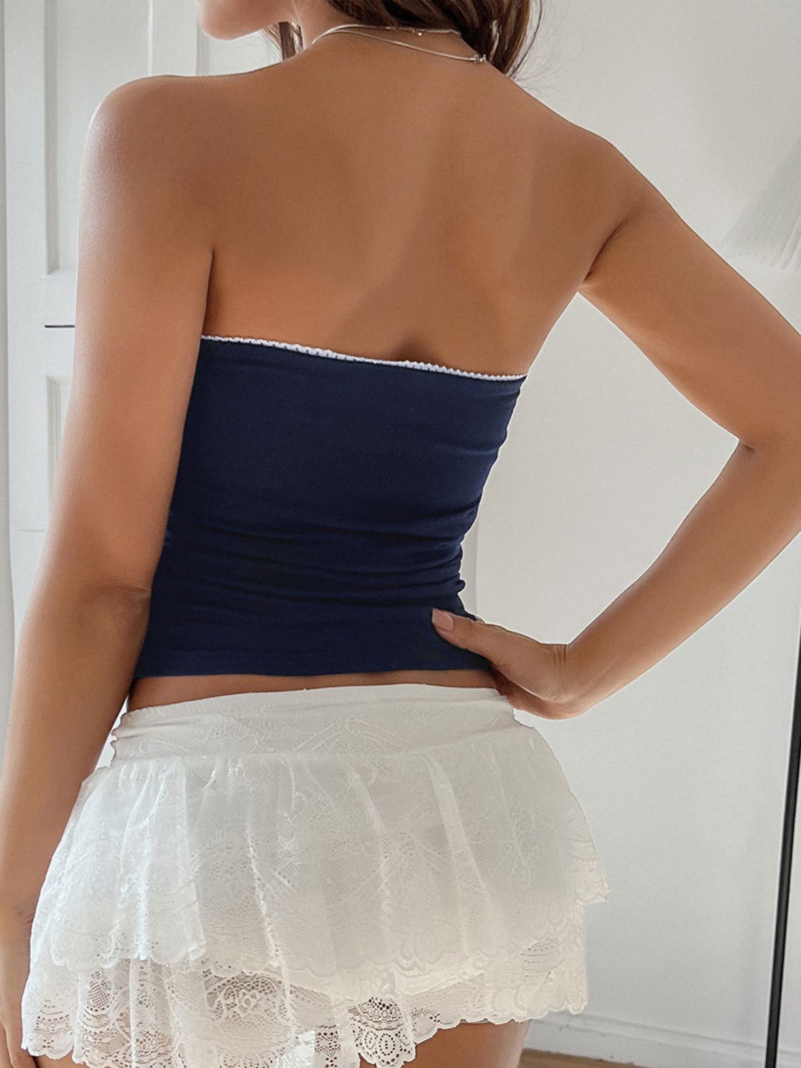 Lace detail bow tube top.
