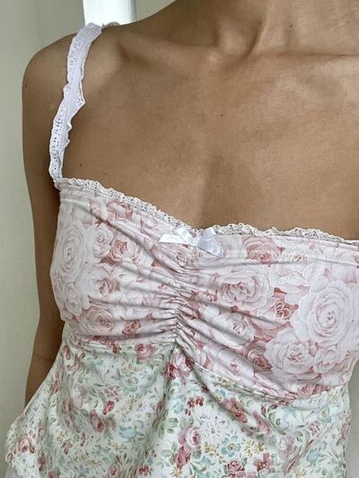 Floral sweetheart neck cami with lace detail, tied back, and bow.