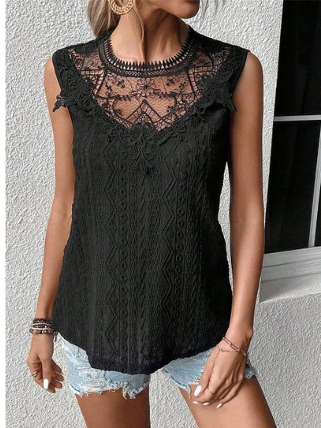 Lace eyelet sleeveless top.