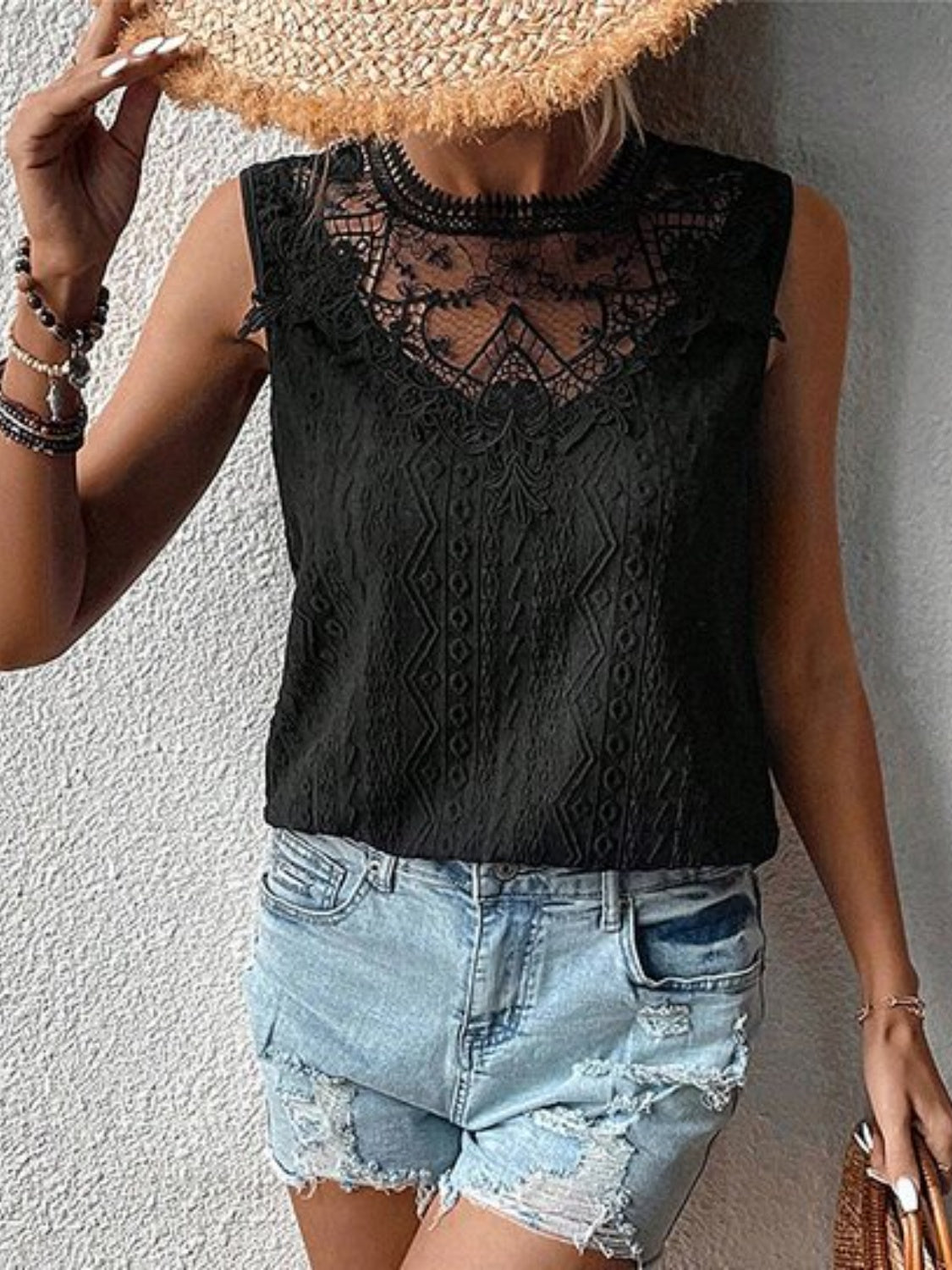 Lace eyelet sleeveless top.