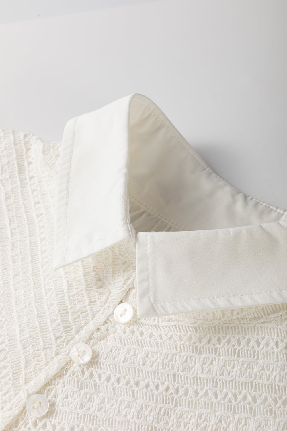 Lace Patchwork Ruffled Cap Sleeve Blouse with Buttoned Details.