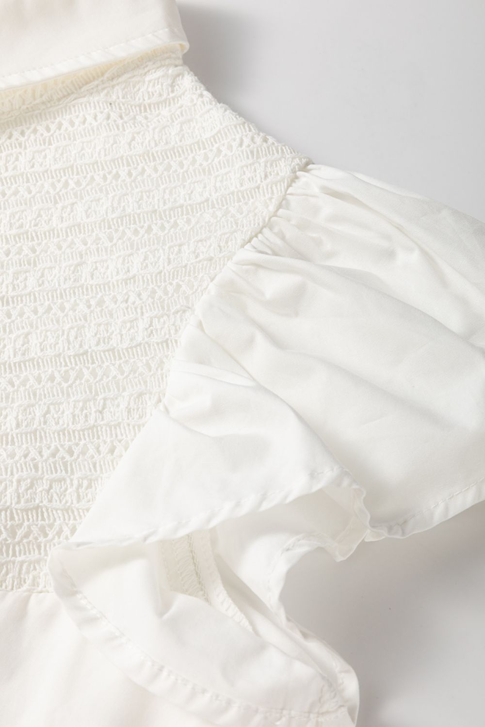 Lace Patchwork Ruffled Cap Sleeve Blouse with Buttoned Details.