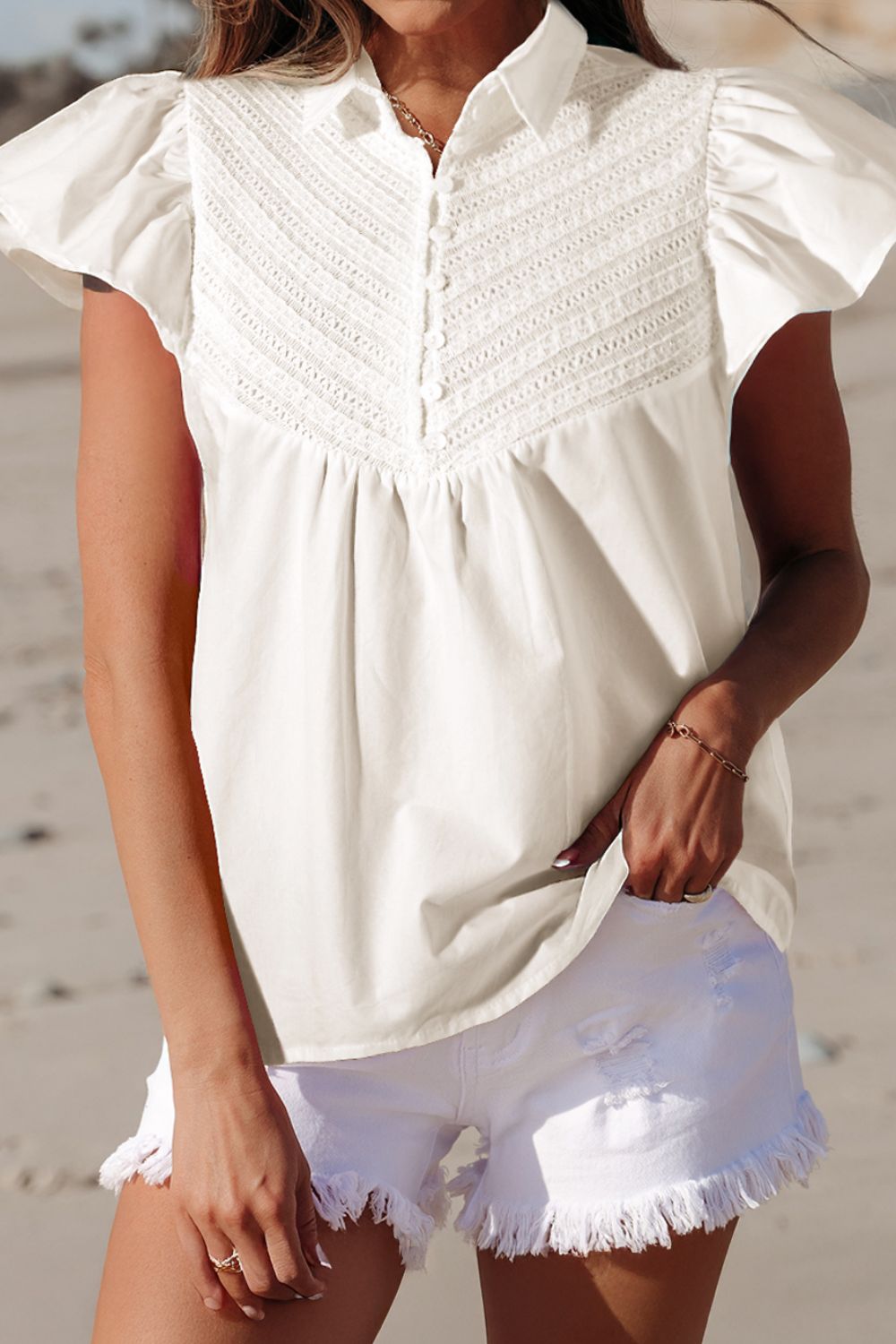 Lace Patchwork Ruffled Cap Sleeve Blouse with Buttoned Details.